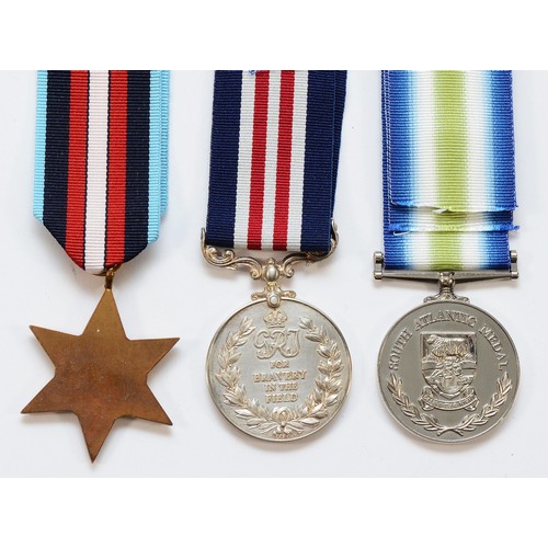 617 - A medal Trio including the WWII Artic Star, George VI Bravery In The Field and A replica South Atlan... 