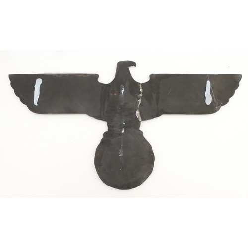 511 - WWII collection of German memorabilia to include a reproduction Wehrmacht eagle wall plaque, an elec... 