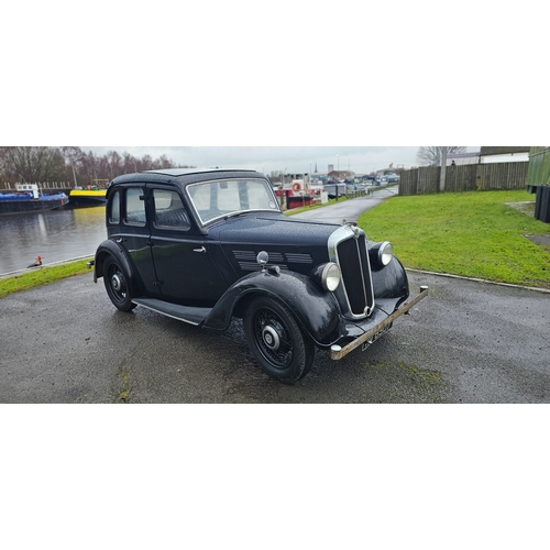 1936 Morris 10/4, 1141cc. Registration number TBC. Chassis number S2/TN 77483. Engine stated on body 61388, V5C says 77483.
Sold with the V5C, Morris Ten-Four operators manual and keys.
The Morris Ten, announced on 1st September 1932, was a medium-sized car introduced for 1933 as the company’s offering in the prominent 10 hp sector of the British market.
With the 10hp category becoming increasingly important, the Ten was an immediate success for Morris. Introduced in August 1932 as saloon or special coupé, a tourer joined the range in December. Powered by a new side valve engine, the Ten was a sturdy if unspectacular performer with excellent braking through Lockheed hydraulics. Four-speed ‘box standard and clutch were the usual cork-linings-in-oil. A new chassis introduced for ’34, along with synchro ‘box. Two-tone colour schemes came along in 1935. 
This 10/4 is presented in blue over black with a blue interior,
there is paperwork to state it was owned by Florence Straton of Northants in May 1945, it then passed to Charles Hill of North Aston in 1981, David Greenwood in 1984 and then Peter Woolmer of Aylesbury in 1994. He sold it to our vendor some ten years ago (his grandfather owned one!). Since that time it has stayed in his dry garage.
He has now decided it is time to part with it and two friends recommissioned it for him. They have fitted a new battery, cleaned the ignition system, rebuilt the carb and fuel pump, the gearbox and diff oil was drained and replaced, petrol tank drained and cleaned, brakes overhauled and a general tidy up. It started with ease and was driven onto our trailer, since when it has been driven around our grounds. Further safety checks should be conducted before serious road use.