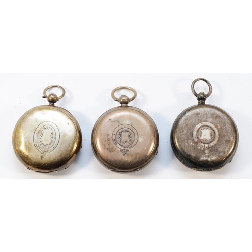 12 - Three silver open face pocket watches, two working when catalogued (3)