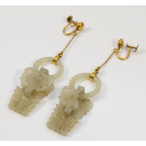 76 - A pair of carved jade screw back drop earrings, 70mm total drop, 43mm jade section, cracks to the ja... 