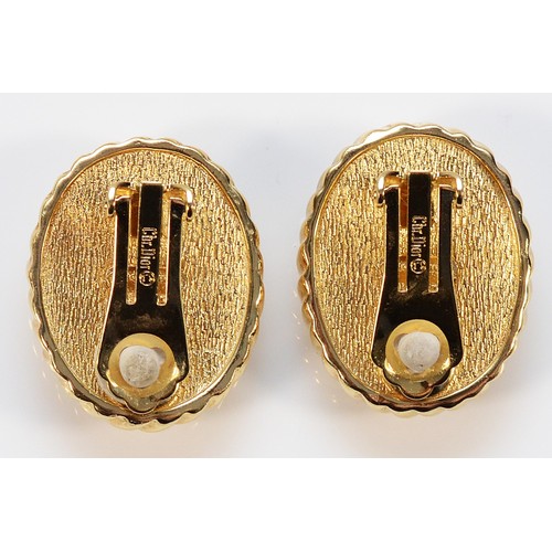 77 - Christian Dior, a pair of signed gilt metal imitation Mabe pearl clip on earrings, 30mm, 28g