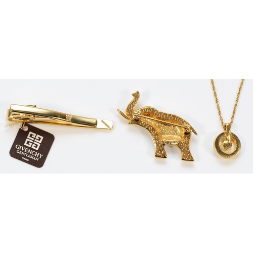 81 - Givency, gilt metal tie clip, 50mm, D'Orlan, gilt metal pendant and chain, with a D'Orlan gilt metal... 