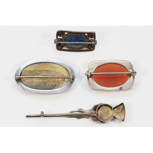 90 - Four sterling silver gemset brooches to include an Arts & Crafts example and another in the shape of... 