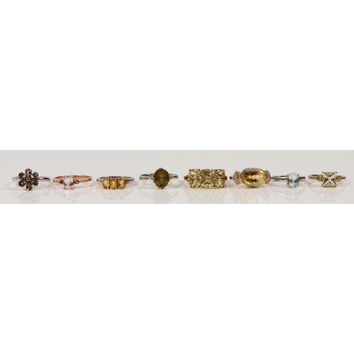 92 - Eight sterling silver gemset rings to include citrine and smokey quartz examples, varying sizes from... 