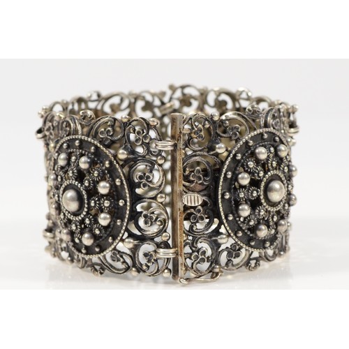 100 - A Scandinavian 835 silver ornate panel bracelet, each panel 43mm square, 18cm, 79g