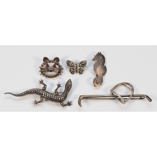 101 - A Stavre Gregor Panis sterling silver seahorse brooch, with four other silver and marcasite examples... 