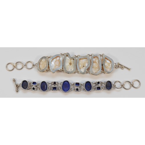 103 - A 925 silver lapis lazuli bracelet, 18.5cm, with a 925 silver and pearl bracelet, 17cm, with extende... 