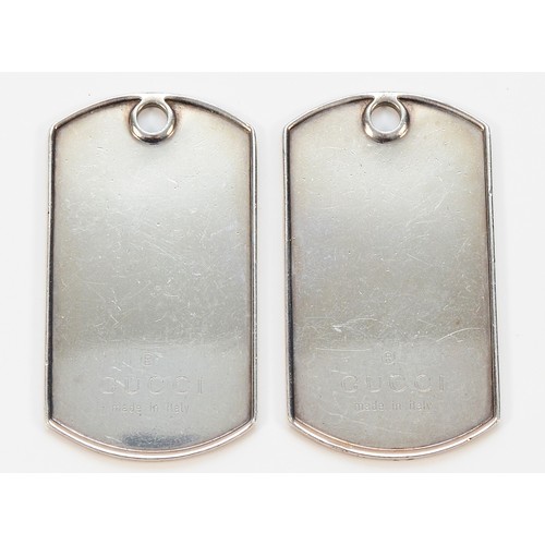 104 - A pair of 925 silver Gucci dog tag pendants, 50mm x 25mm, 36g