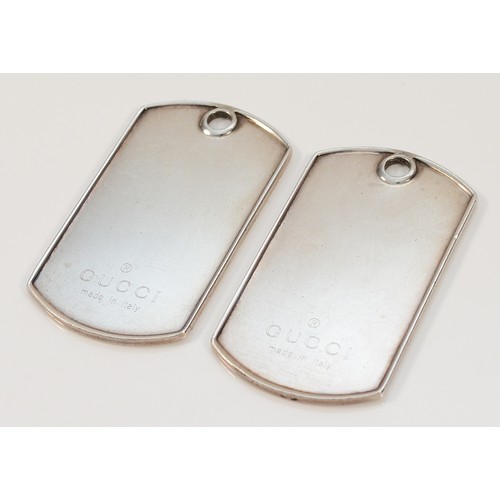 104 - A pair of 925 silver Gucci dog tag pendants, 50mm x 25mm, 36g