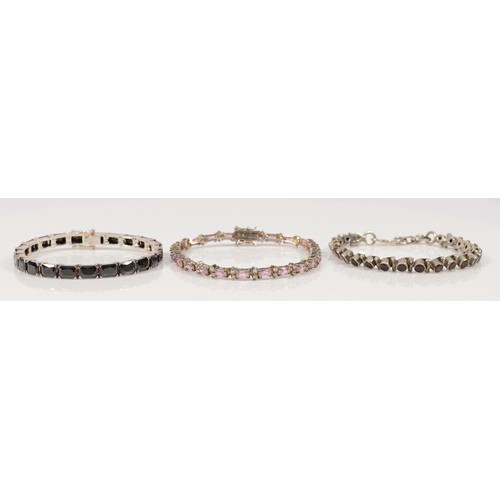 107 - Three 925 silver and gemset line bracelets, to include garnet and cubic zirconia examples, 18-20cm, ... 