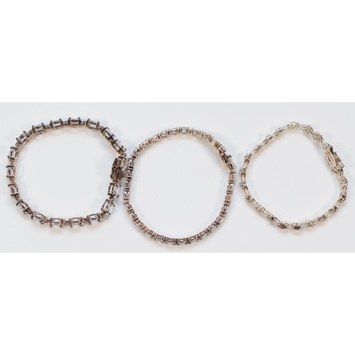 114 - Three 925 silver and cubic zirconia line bracelets, 18-19cm, 43g