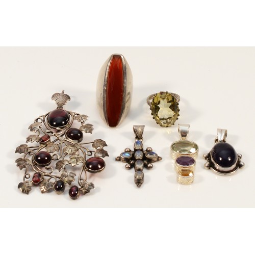 119 - A 925 silver Arts & Crafts style pendant with cabochon cut garnets, 80mm, three 925 silver and gemse... 