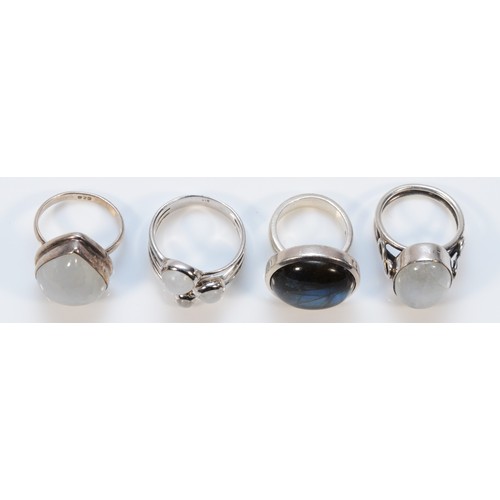 130 - Three 925 silver and moonstone rings, together with a 925 silver and labradorite ring, M-V, 36g