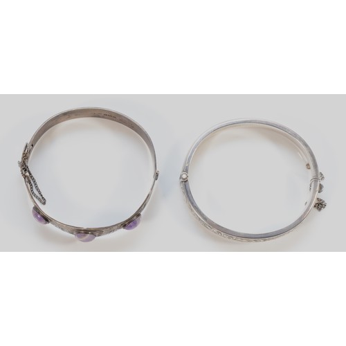 142 - Excalibur, sterling silver and amethyst quartz hinged bangle, 60mm, with a sterling silver embossed ... 