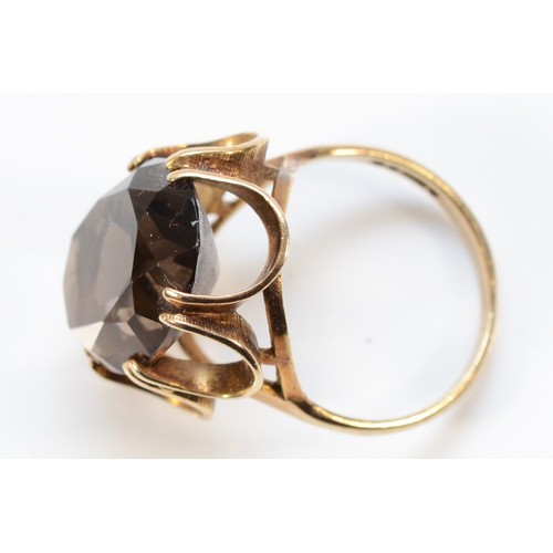 186 - A 9ct gold smokey quartz dress ring, 18mm x 13mm, O, 5.6g