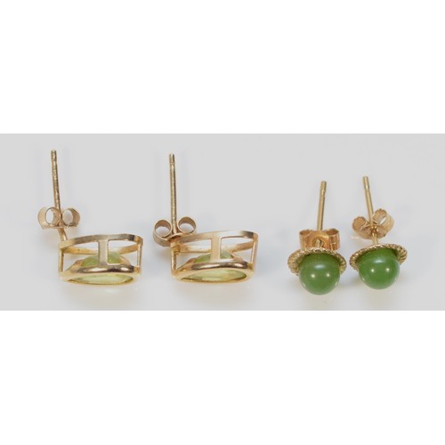 196 - A pair of 9ct gold nephrite earrings with scroll backs, together with a pair of 9ct gold peridot tea... 