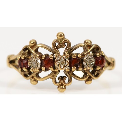 215 - A 9ct gold garnet and diamond dress ring, T, 2.3g