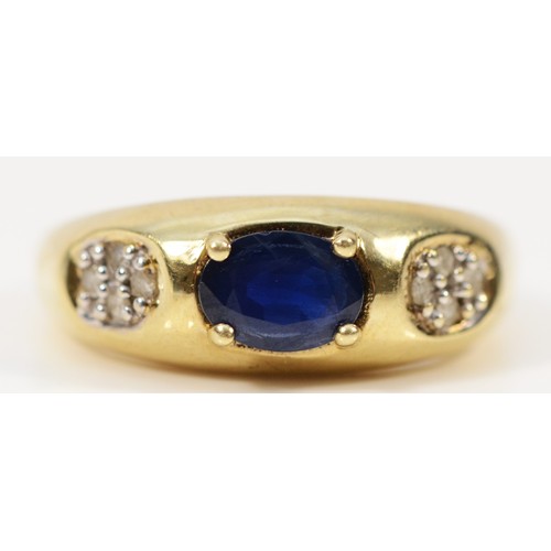 218 - A 9ct gold oval cut blue gemstone and diamond dress ring, O, 3g