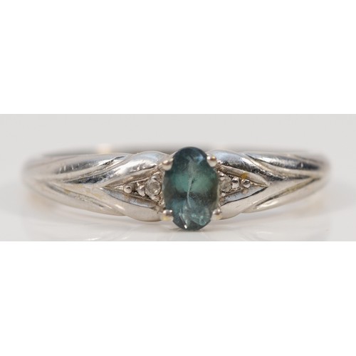 228 - A 9ct white gold green gemstone and diamond ring, X, 3.9g