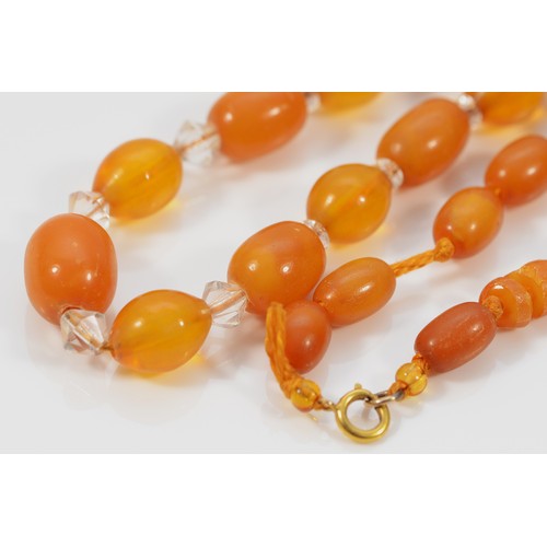 234 - A 9ct gold clasp amber and clear gemstone beaded necklace, 34.6g