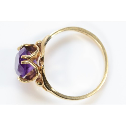 240 - A 9ct gold amethyst solitaire ring, M 1/2, 2.5g