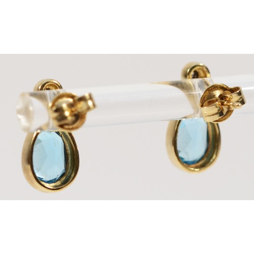 241 - A pair of 9ct gold diamond and blue gemstone earrings with scroll backs, 2.2g