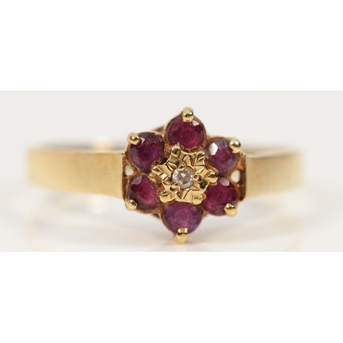 258 - A 9ct gold diamond and ruby floral cluster ring, N, 1.4g