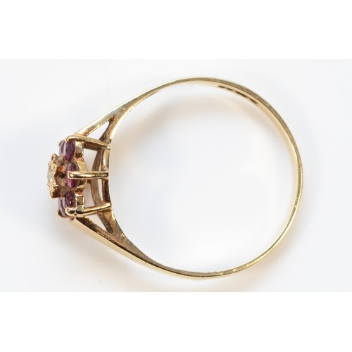 258 - A 9ct gold diamond and ruby floral cluster ring, N, 1.4g