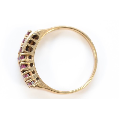 260 - A 9ct gold ruby and diamond two row ring, M, visible resizing mark to the band, 2.5g