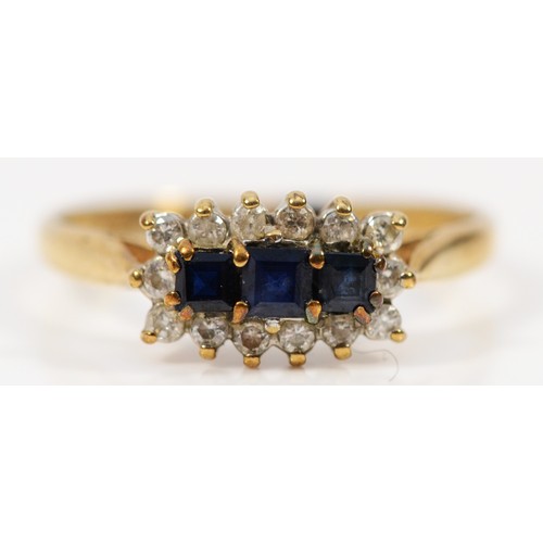 265 - A 9ct gold diamond and sapphire three stone cluster ring, N, 1.7g