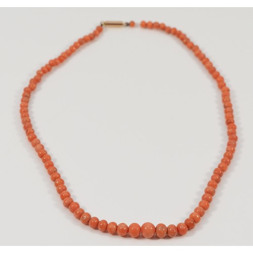 266 - A 9ct gold clasp beaded coral necklace, graduating bead size, largest 6mm, 12.3g