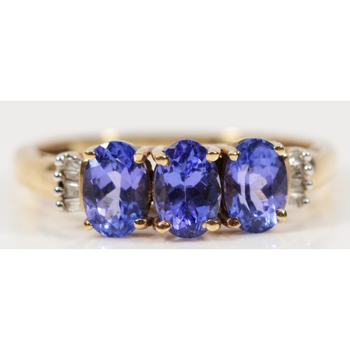 267 - A 9ct gold diamond and tanzanite three stone ring, O 1/2, 1.9g