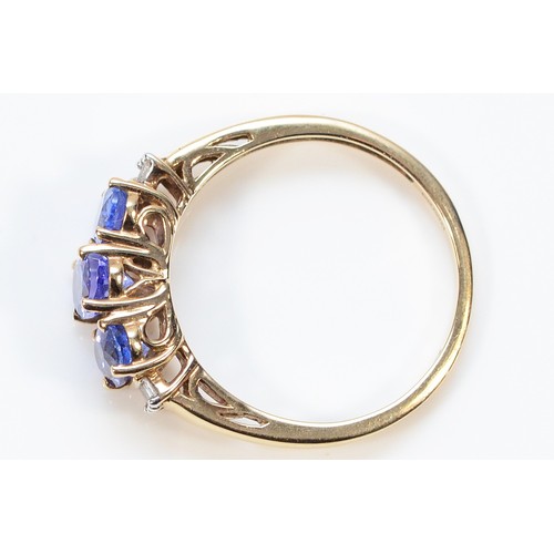 267 - A 9ct gold diamond and tanzanite three stone ring, O 1/2, 1.9g