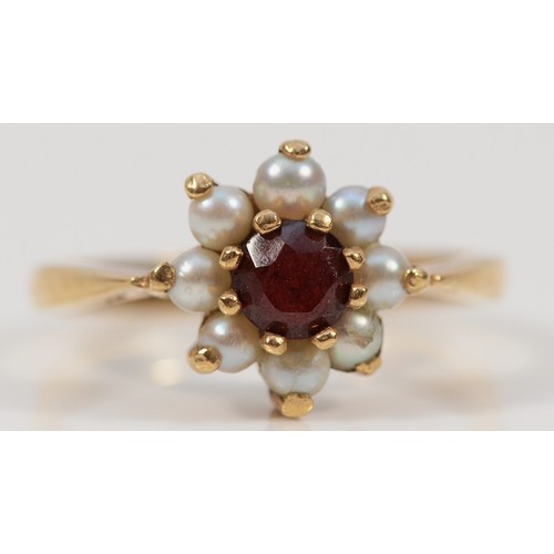 270 - A 9ct gold garnet and seed pearl floral cluster ring, L, 2.4g