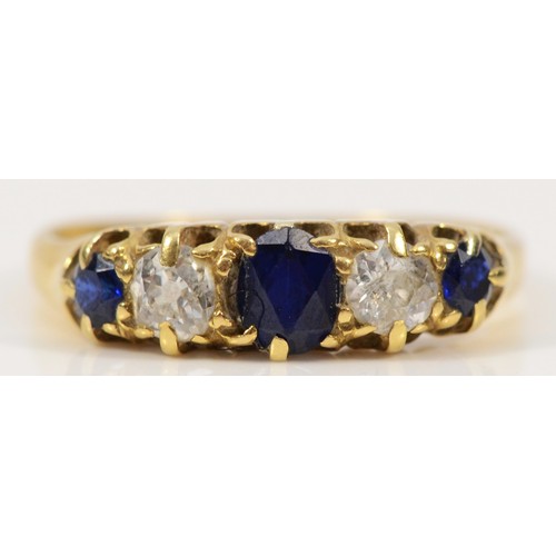 An 18ct gold sapphire and old cut diamond five stone ring, L 1/2, 2.5g