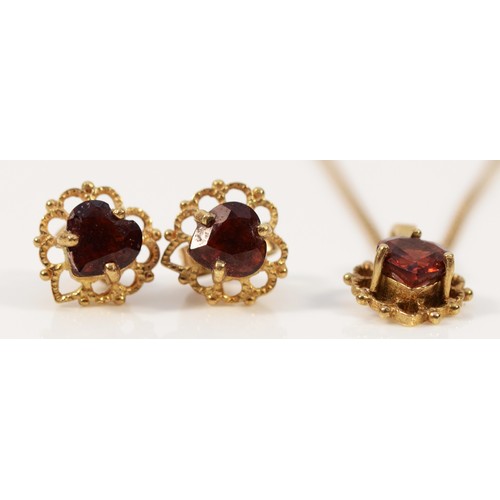 281 - A pair of 9ct gold heart shaped garnet earrings with scroll backs, with a matching pendant on a chai... 