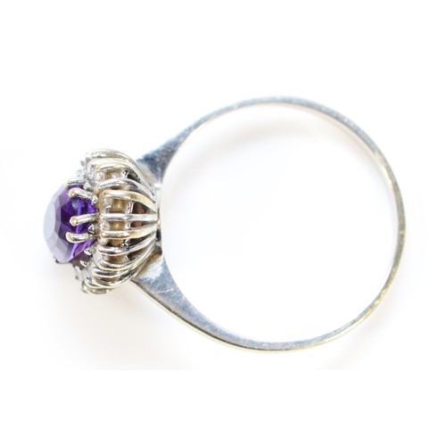 282 - A 14k white gold amethyst and brilliant cut diamond cluster ring, R, 3.8g