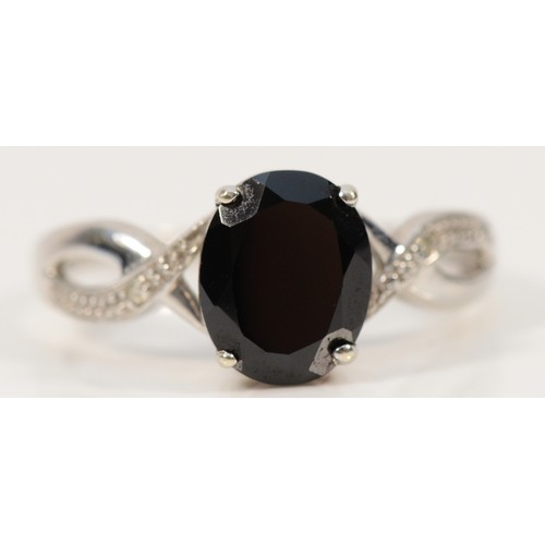 290 - A 9ct white gold black gemstone and diamond cross over ring, S, 3.4g