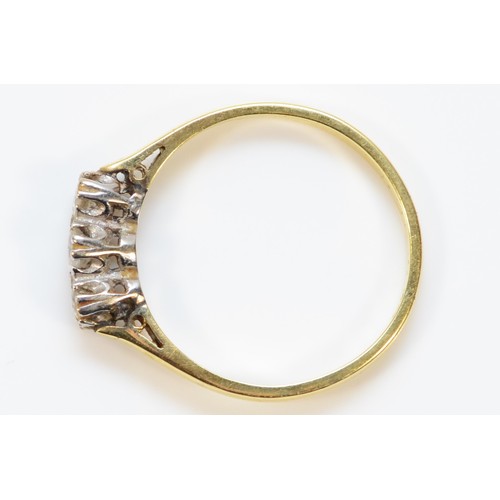 291 - An 18ct gold brilliant cut diamond three stone ring, 2.4g