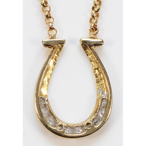 293 - A 9ct gold diamond horseshoe pendant necklace, 3.5g