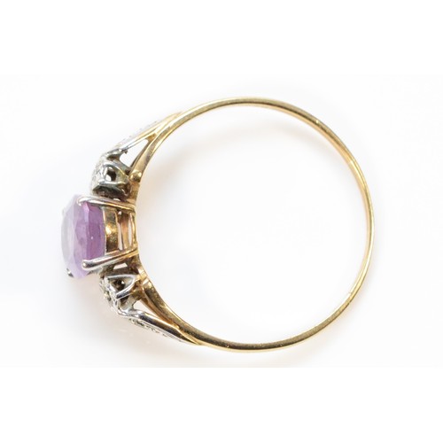 297 - A 9ct gold amethyst and diamond dress ring, Birmingham 1992, T, 1.8g