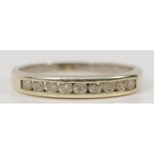 304 - A 9ct white gold diamond half eternity ring, channel set, L, 1.7g