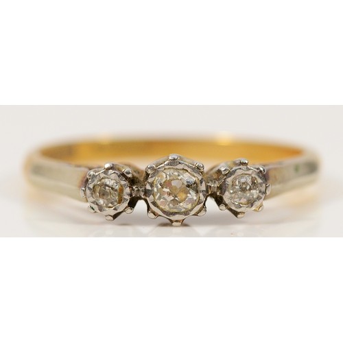 325 - An 18ct gold and platinum diamond three stone ring, R 1/2, 3.2g