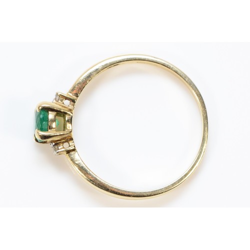 338 - A 9ct gold emerald and diamond three stone ring, N, 1.5g