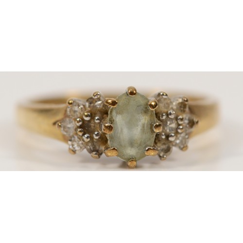 349 - A 9ct gold diamond and blue gemstone cluster ring, I, 2g