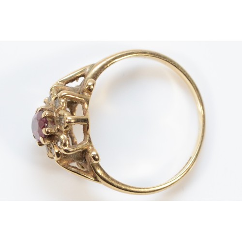 352 - A 9ct gold diamond and red gemstone cluster ring, I 1/2, 2.1g