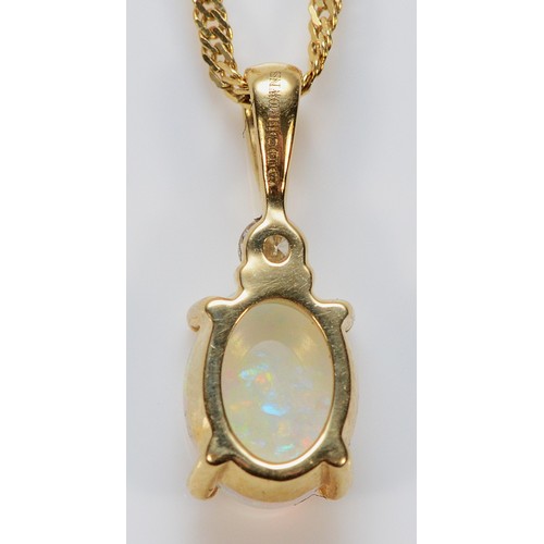 367 - A 9ct gold opal and brilliant cut diamond pendant on a twist chain, 10mm, 2.4g