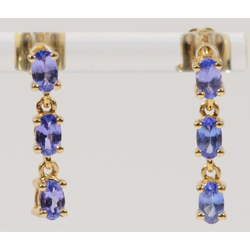 374 - A pair of 9ct gold tanzanite three stone drop earrings, 20mm, 2.3g