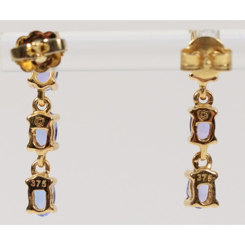 374 - A pair of 9ct gold tanzanite three stone drop earrings, 20mm, 2.3g